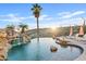 Resort-style pool and spa with a waterfall and lounge chairs at 13231 N El Pueblo Blvd, Fountain Hills, AZ 85268