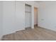 Bedroom with wood-look tile flooring and a closet at 1357 E Cherrywood Pl, Chandler, AZ 85249