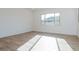 Spacious bedroom featuring wood-look floors and natural light at 1357 E Cherrywood Pl, Chandler, AZ 85249