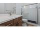 Modern bathroom with white tile shower and wood vanity at 1364 E Nolan Pl, Chandler, AZ 85249