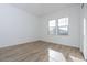 Bright bedroom with wood-look floors and large windows at 1364 E Nolan Pl, Chandler, AZ 85249