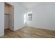 Light and airy bedroom with wood-look floors and closet at 1364 E Nolan Pl, Chandler, AZ 85249