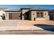 Single-story home with brown garage door and light brown brick exterior at 1364 E Nolan Pl, Chandler, AZ 85249