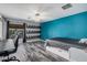 Bright bedroom with built-in shelving and wood-look floors at 14570 N 142Nd Ln, Surprise, AZ 85379