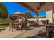 Outdoor patio with built-in grill and dining area at 14570 N 142Nd Ln, Surprise, AZ 85379