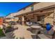 Spacious backyard patio with seating and fire pit at 14570 N 142Nd Ln, Surprise, AZ 85379