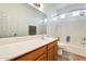 Clean bathroom with a bathtub, shower, and double vanity at 14614 N 153Rd Ct, Surprise, AZ 85379