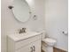 Small bathroom with toilet, sink, and vanity at 14614 N 153Rd Ct, Surprise, AZ 85379