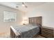 Cozy bedroom with wood-framed bed and neutral color palette at 14614 N 153Rd Ct, Surprise, AZ 85379