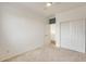 Bedroom with double door closet and access to hallway at 14614 N 153Rd Ct, Surprise, AZ 85379