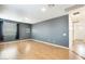 Bright bedroom featuring wood flooring and neutral walls at 14614 N 153Rd Ct, Surprise, AZ 85379