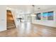 Bright dining room with hardwood floors and a view into the kitchen at 14614 N 153Rd Ct, Surprise, AZ 85379