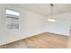 Bright dining room with large window and modern light fixture at 14614 N 153Rd Ct, Surprise, AZ 85379