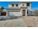 Two-story house with a two-car garage and a landscaped front yard at 14614 N 153Rd Ct, Surprise, AZ 85379