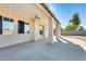 Covered patio with ceiling fan and sliding glass door at 14614 N 153Rd Ct, Surprise, AZ 85379