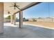 Covered patio with ceiling fans, concrete flooring, and a view of the backyard at 14614 N 153Rd Ct, Surprise, AZ 85379