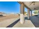 Covered patio with ceiling fans, concrete flooring, and a view of the backyard at 14614 N 153Rd Ct, Surprise, AZ 85379