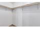 Spacious closet with wood shelving and hanging rods at 1502 E Angela Dr, Phoenix, AZ 85022