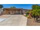 House exterior with covered carport and landscaping at 1502 E Angela Dr, Phoenix, AZ 85022