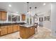 Spacious kitchen with island, wood cabinets, and granite countertops at 1502 E Angela Dr, Phoenix, AZ 85022