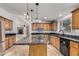 Kitchen with granite countertops and wood cabinets at 1502 E Angela Dr, Phoenix, AZ 85022