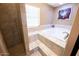 Spa-like bathroom with a large soaking tub and shower at 15021 N 19Th Way, Phoenix, AZ 85022