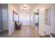 Bright entryway with tiled floors and a wooden bench at 15021 N 19Th Way, Phoenix, AZ 85022