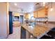 Spacious kitchen with granite countertops and light wood cabinets at 15021 N 19Th Way, Phoenix, AZ 85022