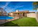 Turf lawn, fenced pool, and covered patio at 1511 W El Monte Pl, Chandler, AZ 85224