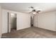 Bedroom with ceiling fan, carpet, and closet at 1511 W El Monte Pl, Chandler, AZ 85224