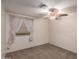 Bright bedroom with ceiling fan and carpeted floor at 1511 W El Monte Pl, Chandler, AZ 85224