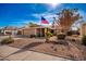 Single story home with a spacious front yard and American flag at 1511 W El Monte Pl, Chandler, AZ 85224