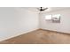 Well-lit bedroom with ceiling fan and neutral wall colors at 1527 W Rosemonte Dr, Phoenix, AZ 85027