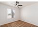 Bright bedroom with ceiling fan and window at 1527 W Rosemonte Dr, Phoenix, AZ 85027