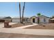 White single story home with a two car garage, landscaped yard, and walkway at 1527 W Rosemonte Dr, Phoenix, AZ 85027