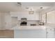 Modern kitchen featuring white cabinets and quartz countertops at 1527 W Rosemonte Dr, Phoenix, AZ 85027