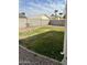 Small backyard with grass and gravel, bordered by block wall at 15350 W Mauna Loa Ln, Surprise, AZ 85379