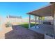 Relaxing backyard oasis with covered patio and hot tub at 15350 W Mauna Loa Ln, Surprise, AZ 85379