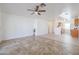 Open living room and kitchen with tile flooring at 15350 W Mauna Loa Ln, Surprise, AZ 85379