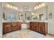 Large bathroom with double vanity and big mirrors at 15526 W Minnezona Ave, Goodyear, AZ 85395