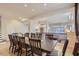 Formal dining room with a large table and view of living area at 15526 W Minnezona Ave, Goodyear, AZ 85395