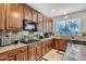 Modern kitchen featuring stainless steel appliances and granite countertops at 15526 W Minnezona Ave, Goodyear, AZ 85395