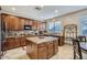 Spacious kitchen with granite countertops and ample wood cabinetry at 15526 W Minnezona Ave, Goodyear, AZ 85395