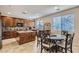 Kitchen with an island, wood cabinets, and breakfast nook at 15526 W Minnezona Ave, Goodyear, AZ 85395