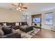 Relaxing living room with sectional sofa and large TV at 15526 W Minnezona Ave, Goodyear, AZ 85395