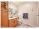 Clean bathroom with light wood vanity and shower at 17200 W Bell Rd # 1165, Surprise, AZ 85374