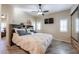 Comfortable bedroom with large bed and ceiling fan at 17200 W Bell Rd # 1165, Surprise, AZ 85374