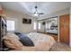 Spacious bedroom with mirrored closet and ceiling fan at 17200 W Bell Rd # 1165, Surprise, AZ 85374