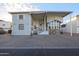 Single-story home with covered porch and landscaped yard at 17200 W Bell Rd # 1165, Surprise, AZ 85374