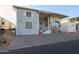 Single-story home with covered porch and landscaped yard at 17200 W Bell Rd # 1165, Surprise, AZ 85374